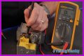How do you test a Honeywell gas valve with a multimeter?